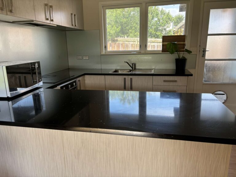 Clean kitchen benchtop and splashback